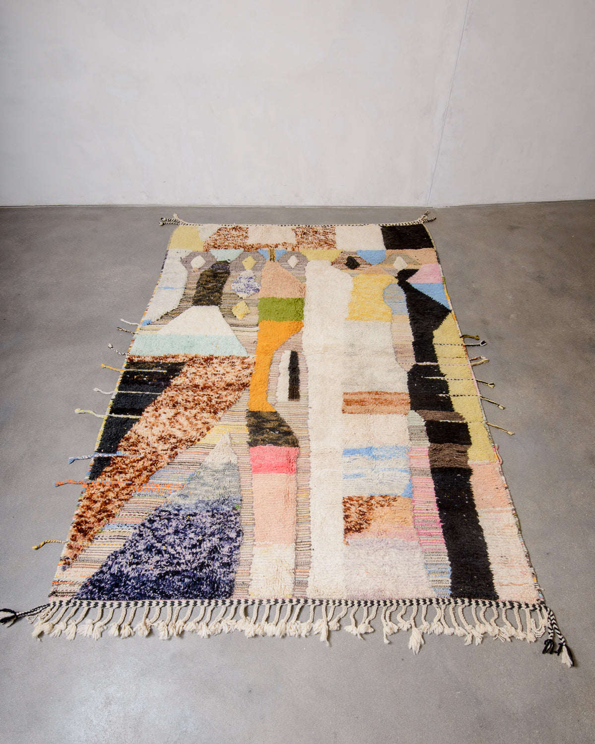 Modern, designer, handcrafted Berber rug from Morocco. Beniourain carpet with beautiful colours and patterns and fluffy wool texture.